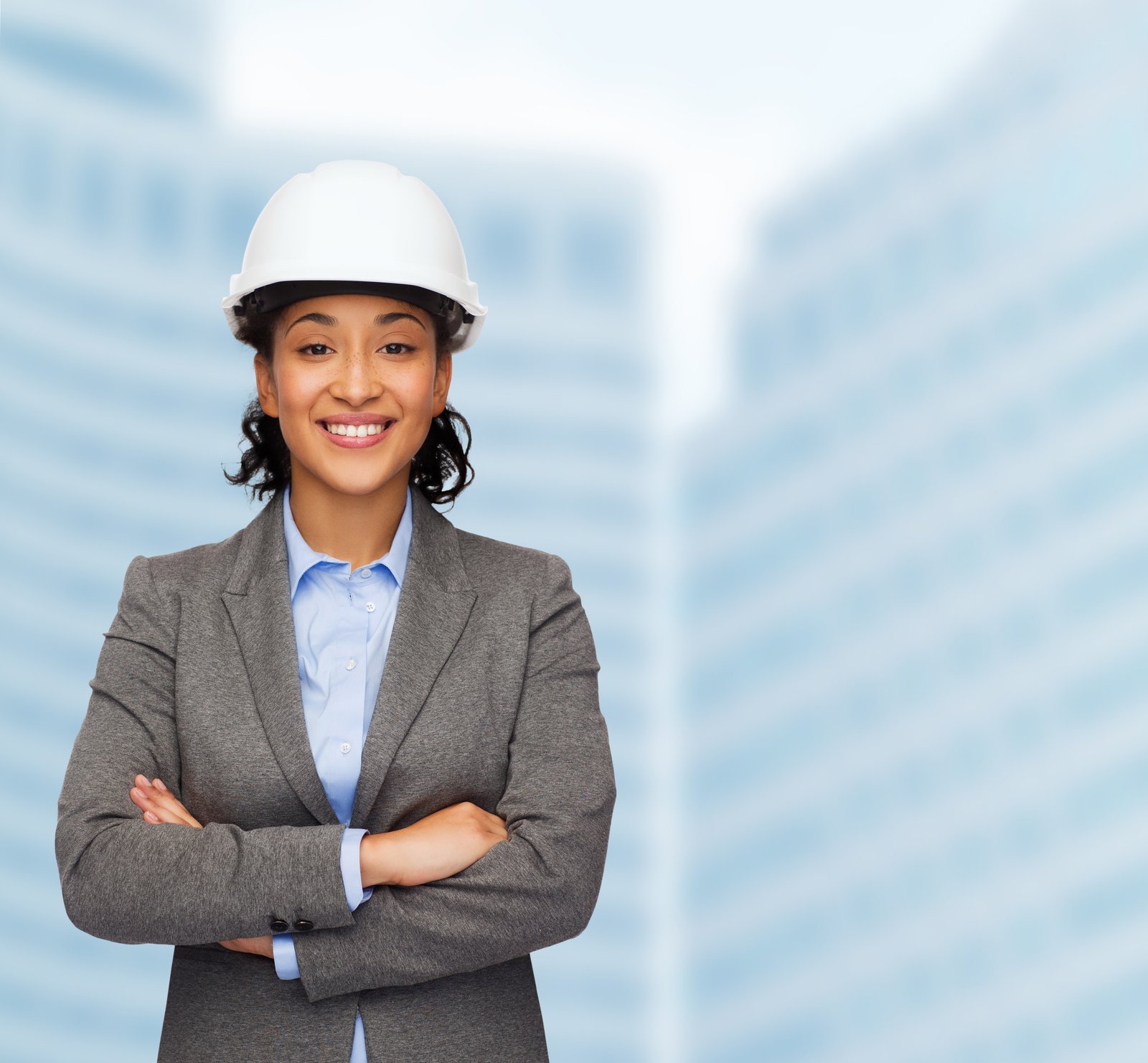 XTRM Group | Female architect posing for a picture with a smile.